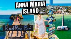 a woman is standing on a dock with many signs in front of her and the ocean behind her