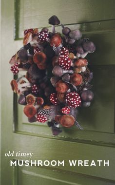 an old time mushroom wreath hangs on the front door