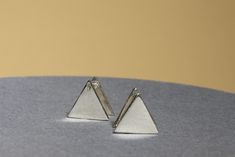 Triangle Small Earring  The most unique jewelry you can find, perfect gift for your loved one  Made in  Sterling Silver.  Minimal and meaningful, this earring is an awesome way to add some thoughtful personalization to your collection. * the premium hand formed Earring * 100% sterling silver  * Dimension: 10 mm Lengthin * Dimension: 10 mm Width * all sourced from USA  Send us a message if you need more help :) Hypoallergenic Triangle Earrings For Gift, Triangle Shaped Single Earring As A Gift, Triangle Single Earring As Gift, Triangle Earrings As Gift, Triangle Pierced Earrings Gift, Triangle Pierced Earrings As Gift, Modern Cadmium-free Earrings As A Gift, Minimalist Cadmium-free Sterling Silver Earrings, Simple Handmade Earrings For Gifts