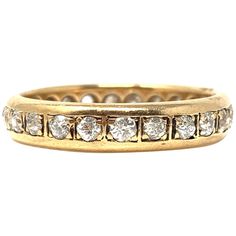 This beautiful and elegant wedding band is hand made in 14 k yellow gold. White diamond : 0.70 carat ( HI color and VS clarity ) Metal : 14 k yellow gold Ring Size : 7 Gold Wedding Band With Channel Set, Gold Eternity Band Channel Set, Gold Eternity Band With Channel Set, Yellow Gold Diamond Eternity Band With Channel Setting, Heirloom Gold Eternity Band With Brilliant Cut, Classic Gold Eternity Band With Single Cut Diamonds, Classic Yellow Gold Eternity Band With Single Cut Diamonds, Classic Yellow Gold Half Eternity Diamond Ring, Yellow Gold Eternity Band With Channel Set