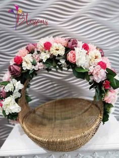 a basket filled with flowers on top of a table