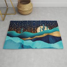 a rug with cactus trees and stars in the night sky on a floor next to a basket