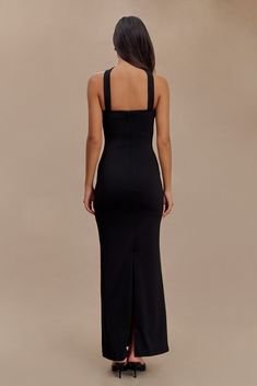 Boldly elegant. The VELMA Halter Collar Maxi Dress with Overlay is a striking blend of elegance and modern sophistication. Featuring a straight neckline and a halter design, this dress showcases a front collar detail that adds a refined touch. The fitted bodice enhances your silhouette, while the maxi length and back vent offer graceful movement and a dramatic effect. The back zip closure ensures a seamless fit, making the Velma Dress a perfect choice for formal events or special occasions where you want to make a memorable impression. Dress With Overlay, Collar Maxi Dress, Graceful Movement, Straight Neckline, Fitted Bodice, Black Maxi Dress, Formal Event, Latest Fashion Trends, Bodice