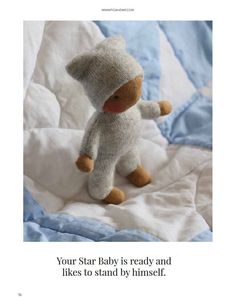 a stuffed animal that is on top of a bed with the caption your star baby is ready and likes to stand by himself