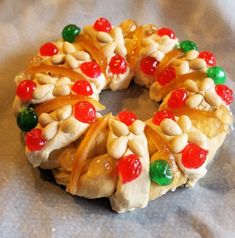 a christmas wreath made out of pretzels and candy