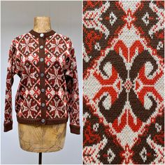 * Women's wool cardigan c 1960s/1970s * Nordic style snowflake pattern in burnt orange and brown on ivory background * Brown ribbing at wrist, hem, collar and front placket * Long, set-in sleeves  * 7 embossed metal snowflake button front closure Label: Tami Excellent condition  Bust: 42 Shoulder: 18 Sleeve: 21 Length: 21 Garments are flat-measured. Please compare these measurements to another flat-measured garment that fits you correctly for size comparison. Don't forget to leave room for body Retro Wool Cardigan With Fair Isle Pattern, Vintage Brown Cardigan For Winter, Vintage Brown Winter Cardigan, Vintage Brown Wool Cardigan, Retro Orange Cardigan For Winter, Retro Orange Winter Cardigan, Vintage Wool Outerwear With Fair Isle Pattern, Vintage Wool Cardigan With Fair Isle Pattern, Vintage Brown Sweater With Fair Isle Pattern