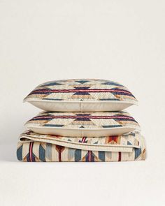 two pillows stacked on top of each other