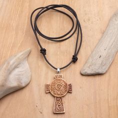 Leather Cord Pendant Necklace with Celtic Cross - Cross of Two Worlds | NOVICA Spiritual Cross Necklace With Large Pendant, Spiritual Cross Pendant Necklace For Blessing, Spiritual Necklace With Cross Pendant For Blessing, Engraved Cross Necklace For Blessing, Spiritual Crucifix Jewelry With Large Pendant, Spiritual Jewelry With Large Crucifix Pendant, Spiritual Cross Pendant Necklace, Spiritual Pendant Cross Necklace, Adjustable Spiritual Cross Pendant Necklace