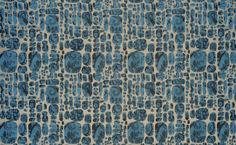 an abstract blue and white pattern on fabric