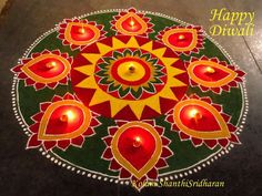 happy diwali with candles on the ground