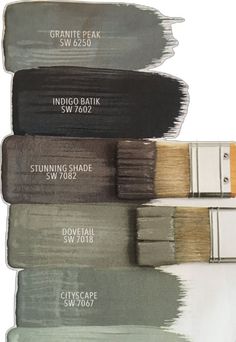 some paint colors with different shades and names on them, including brown, gray, white, and black