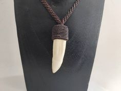 - Description - Handmade necklace made by real amazonian crocodile teeth. A truly unique and rare piece which takes a lot of work to create. Waterproof so you can safely wear at the beach. - Size - P-1 :67cm , Pendant height : 7.50cm. P-2 :fully adjustable. Pendant height : 8cm - Shipping info - This piece is ready and will be sent to the shipping company ems within 1-3 days, depending on the existing workload at the time of the order. In the case of a delay or issue, you will be informed in adv Crocodile Teeth, Tooth Pendant, Tooth Necklace, Ethnic Necklaces, Shipping Company, Handmade Necklace, Cyprus, Handmade Necklaces, At The Beach