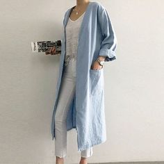 Elegant and breezy, our Longline Linen Cardigan is an essential for summer layering. The light linen fabric will keep you cool yet covered, and the loose fit is certain to provide maximum comfort. Wear over lightweight trousers and a summery top for the perfect casual look. Trench Coats Women Long, Mandarin Collar Shirt, Loose Cardigan, Loose Coats, Gilet Long, Long Trench, Long Trench Coat, Cardigan Long, Retro Women