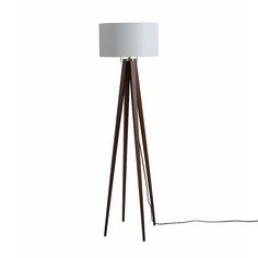 a wooden floor lamp with a white shade on the top and one light on the bottom