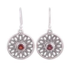 Blooming like flower petals sterling silver dotted openwork is crafted by hand to surround two circular gemstones of natural garnet. Alok Jain presents this gleaming pair of dangle earrings which are crafted by local Indian artisans. Ornate Round Gemstone Earrings, Nickel-free Round Garnet Jewelry, Round Garnet Filigree Jewelry, Round Garnet Jewelry For Pierced Ears, Garnet Jewelry With Matching Round Earrings, Ornate Round Garnet Jewelry, Ruby Pendant, Garnet Earrings, Backdrop Decorations