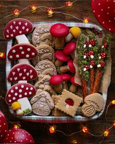 a tray filled with lots of different types of cookies on top of a wooden table