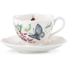 a cup and saucer with a butterfly on it