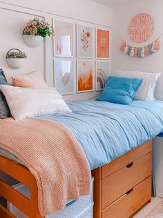 a bed sitting under a window next to a dresser with lots of drawers on top of it