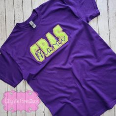 Looking for a new fun shirt to wear this Mardi Gras? This super cute glitter and faux chenille Mardi Gras embroidered shirt is perfect to wear to catch some beads this Mardi Gras season! These shirts are made with a combination of gold glitter heat transfer vinyl a lime green fuzzy microfiber material, that feels just like chenille and purple embroidery. Each letter is appliqued to the sweatshirt, these are not your typical iron on patches!! All shirts are made to order right here at Lilly Pie C Faux Chenille, Purple Embroidery, Glitter Heat Transfer Vinyl, Mardi Gras Shirt, Let The Good Times Roll, Heavy Embroidery, Good Times Roll, Embroidered Shirt, Unisex Shorts