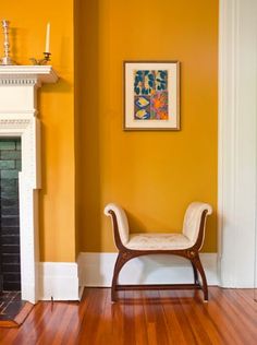 a chair sitting in front of a fire place