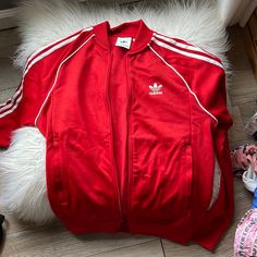 Never Worn Bright Red Track Suit Jacket Adidas Casual Red Track Jacket, Red Long Sleeve Track Jacket For Spring, Red Long Sleeve Spring Track Jacket, Adidas Red Winter Tops, Red Adidas Tops For Winter, Adidas Sporty Red Outerwear, Red Sporty Adidas Outerwear, Sporty Red Adidas Outerwear, Fitted Red Track Jacket For Winter