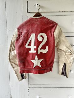 "Outstanding and rare, custom-made iconic Bates California leather cafe racing motorcycle jacket. Stitched leather stars, all original, working zippers, awesome patina. Ghost-stitching on the back where owner's name used to be. Condition note: stiff leather with some deep creases; needs some TLC but structurally sound and wearable. Jacket liner is in great shape. Snap on front bottom looks to be missing its mate. Best for a small size. Jacket measurements flat/zipped: Pit to pit: 17\" Shoulder t 1980s Leather Jacket, Vintage Clothes For Men, Leather Racing Jacket, Vintage Motorcycle Jacket, Motorcycle Jackets, Motorcycle Fashion, Work Jacket, Vintage Biker Style, Vintage Racing Jacket