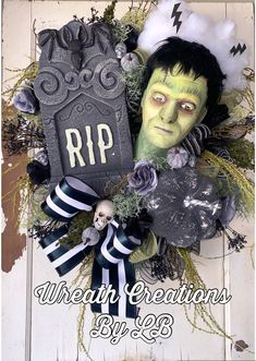 a halloween wreath with a creepy face and green makeup on it, surrounded by black and white decorations