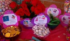 the table is set up with candy, candies and other items for children's birthday