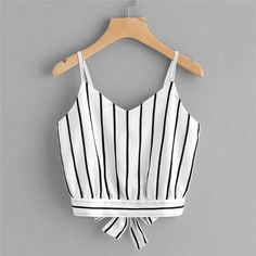 This simple chic cropped is simply perfect. Both sexy and sweet. Featuring a sash bow back and spaghetti straps; this top pairs perfectly with pants, jeans, shorts, skirts and leggings. Made with a polyester blend for comfort & style. Crop Cami Top, Bow Top, Blouse Tank Top, Summer Crop Tops, Cropped Tops, Cami Crop Top, Striped Crop Top, Top Women, Cami Top