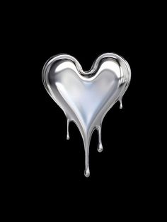 a heart shaped object with dripping paint on it's side, against a black background