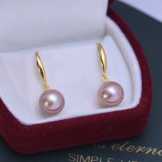 This popular earring design features AAAA quality, round freshwater pearls measuring 10-11mm. Expertly crafted with 10-11mm freshwater pearls, these classic hoop earrings are a timeless addition to any jewelry collection. These elegant and versatile earrings complement any outfit and add a touch of sophistication to your look. Made with high-quality materials, these earrings are built to last and will make a beautiful gift for yourself or a loved one. Product Details: Pearl Type: Freshwater Pear Hypoallergenic Rose Gold Round Pearl Earrings, Round Akoya Pearl Earrings, Rose Gold Pearl Round Earrings, Rose Gold Pearl Charm Earrings, Rose Gold Round Pearl Charm Earrings, Minimalist Rose Gold Round Pearl Earrings, White Gold Pearl Earrings With Ear Wire, Akoya Pearl Earrings With Pearl Charm, Elegant Hypoallergenic Round Hoop Earrings