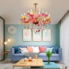 a living room filled with furniture and a colorful chandelier hanging from the ceiling