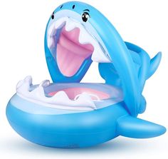 an inflatable toy with a shark on it's back and mouth open