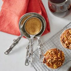 two muffins sitting on top of a cooling rack