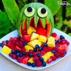 a watermelon carved to look like a mouth full of fruit