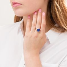 Fashioned in 10K gold, this scroll frame ring features a 12.0 x 10.0mm oval lab-created blue sapphire flanked on each side by a diamond accent, totalling 1/20 cts. Elegant Oval Tanzanite Birthstone Ring, Elegant Gold Ring With Lab-created Sapphire, Formal Oval Tanzanite Birthstone Ring, Elegant Yellow Gold Rings With Lab-created Sapphire, Elegant Sapphire Birthstone Ring In Oval Shape, Elegant Hallmarked Sapphire Birthstone Ring, Elegant Blue Birthstone Ring, Frame Ring, Oval Stone