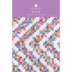 a bookmark with an image of a colorful quilt on it's front cover