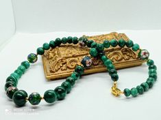 vintage necklace in 24mm malachite beads the largest and cloisonné enamel beads with a 925 silver clasp golden punch, woman Vintage 80-90s Materials: malachite gem, cloisonné enamel beads, silver 925 gold plate Clasp: Typical for China export jewelry, 925G punching Malachite beads round size of beads from 24 mm largest up to 7 mm smallest In all 46 malachite beads All beads have different design and can the shape also that indicates that the beads have made manual! Is in very good condition Gift voucher for women and parties Handmade Elegant Malachite Beaded Necklaces, Gift Beaded Malachite Necklaces, Beaded Malachite Necklace For Gifts, Malachite Beaded Necklace As Gift, Malachite Beaded Necklace For Gift, Malachite 8mm Beads Jewelry Gift, Handmade Malachite Round Bead Necklace, Handmade Gold Necklaces With Malachite, Handmade Gold Malachite Necklaces