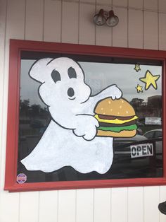 there is a ghost eating a burger in the window