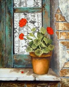 a potted plant sitting on top of a window sill next to a brick wall