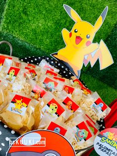 a pokemon themed birthday party with pokeballs, popcorn and pikachu stickers