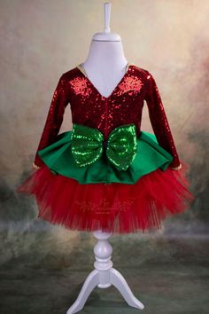 Are you looking for a cute and play friendly party dress for your little girl for Christmas and Holidays? This sweet reindeer Christmas tutu is just perfect for that! It is made of the highest quality satin, sequin, abraham fabric and crystal tulle. It has a V-shape back with a zipper and a big sequin bow. It has a soft satin lining to prevent irritation on the delicate skin of your child. The reindeer headband is included. The Christmas tutu is handmade and will be customized for your little gi Princess Style Christmas Party Dress, Red Princess Dress For Christmas Dress-up, Princess Dresses For Holiday Season, Princess Dresses For Holiday, Christmas Princess Tutu Dress For Party, Christmas Party Princess Tutu Dress, Princess Style Christmas Party Holiday Dress, Princess Tutu Christmas Party Dress, Festive Princess Style Holiday Dress For Party Season