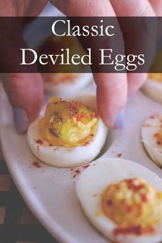 an image of deviled eggs being served on a white plate with the words classic deviled eggs