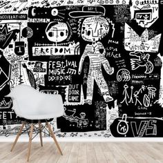 a chair in front of a black and white wall with graffiti written on the walls