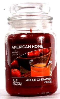 an apple cinnamon cider is in a glass jar