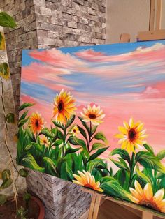 a painting of sunflowers in front of a brick wall with pink sky and clouds