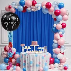 a birthday party with balloons, cake and decorations