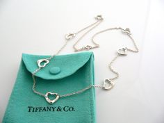 Overview: Offered for sale is a wonderful Tiffany classic. Whether you are just starting your Tiffany collection or are thinking of adding another piece, this one is perfect for you. Tiffany & Co. Elsa Peretti’s 7 Open heart necklace is a Tiffany classic that will never go out of style. Perfect way to say “I love you very much (or I love me a lot!) :)”. It will most certainly be a piece that you will turn to over and over again, so it is great value for your money! It is a wonderful necklace Luxury Heart-shaped Necklaces For Evening, Luxury Heart-shaped Necklace For Evening, Luxury Heart Shaped Necklace For Evening, Classic Jewelry For Valentine's Evening, Open Heart Necklace, I Love Me, Love You Very Much, Charm Chain, Elsa Peretti