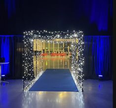 a blue carpet with white lights on it