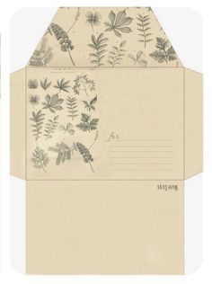 two envelopes with flowers and leaves on them